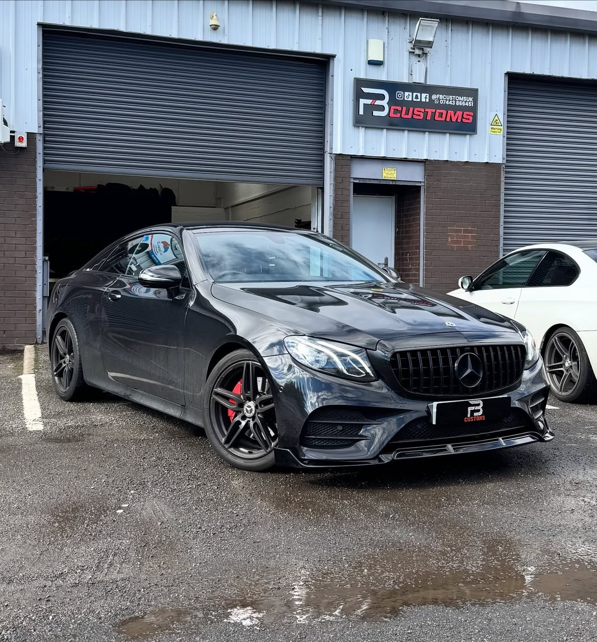 Black Mercedes outside the FB CUSTOMS workshop