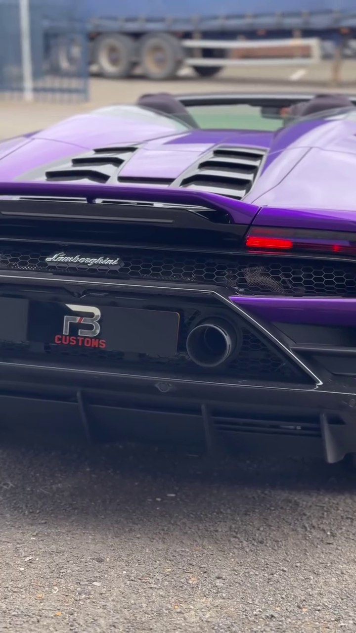 Rear and exhaust detail of a purple Lamborghini